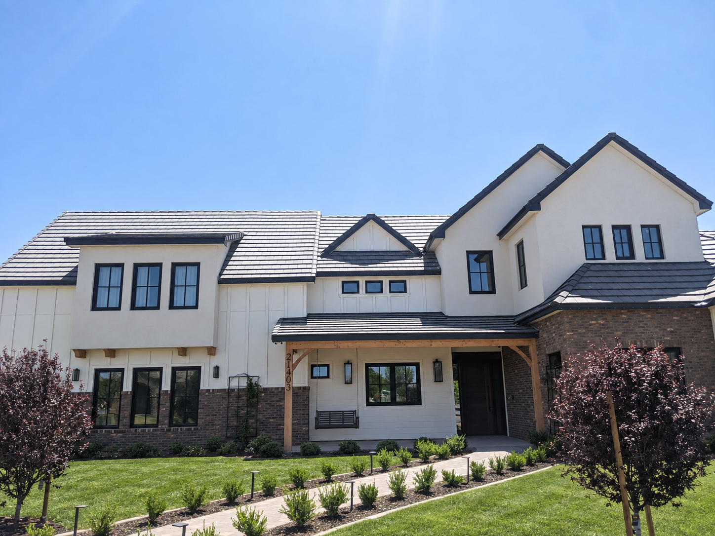 Modern farmhouse daytime exterior representing Queen Creek